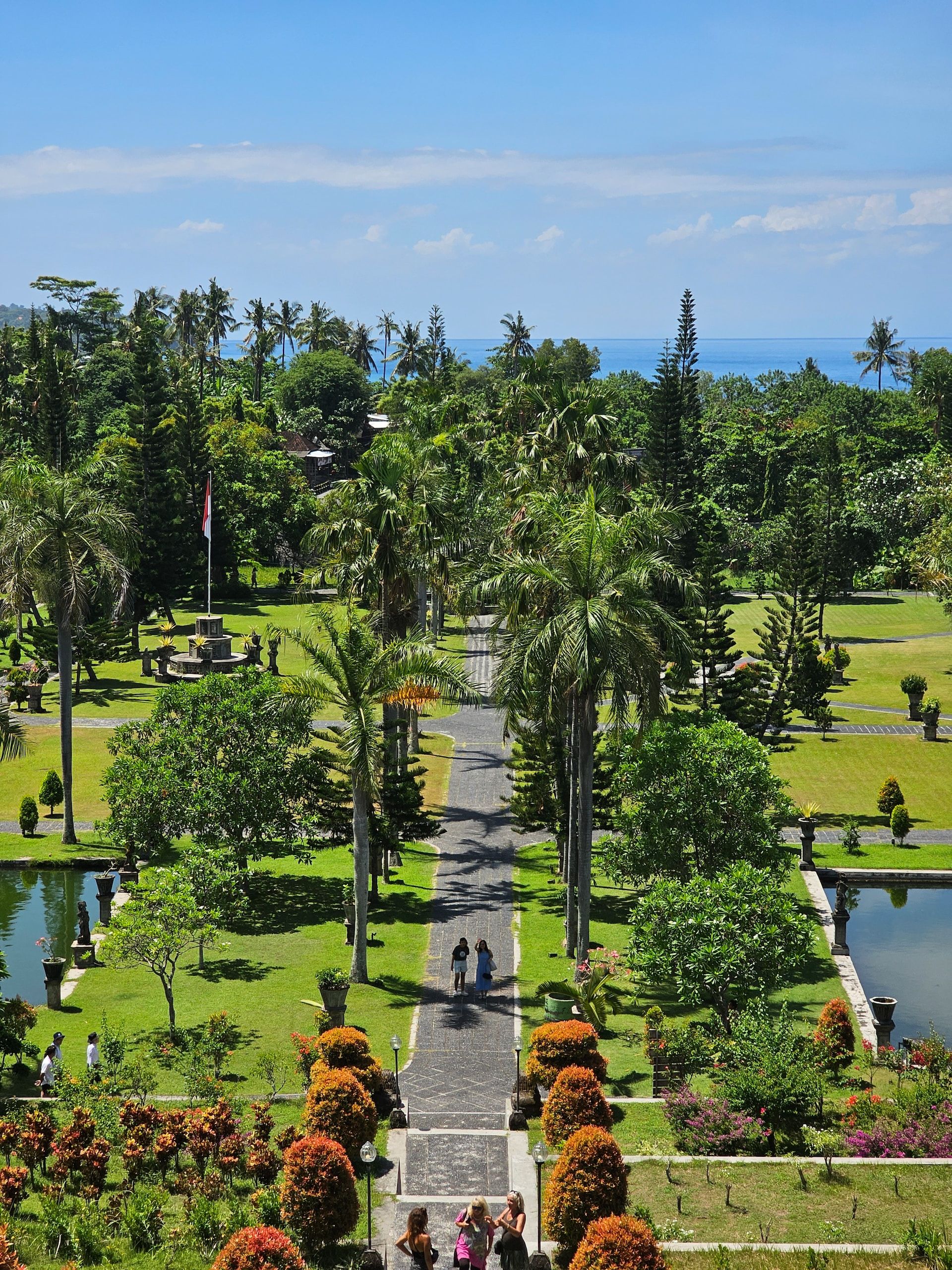 A park filled with trees inside Taman Ujung, Bali
