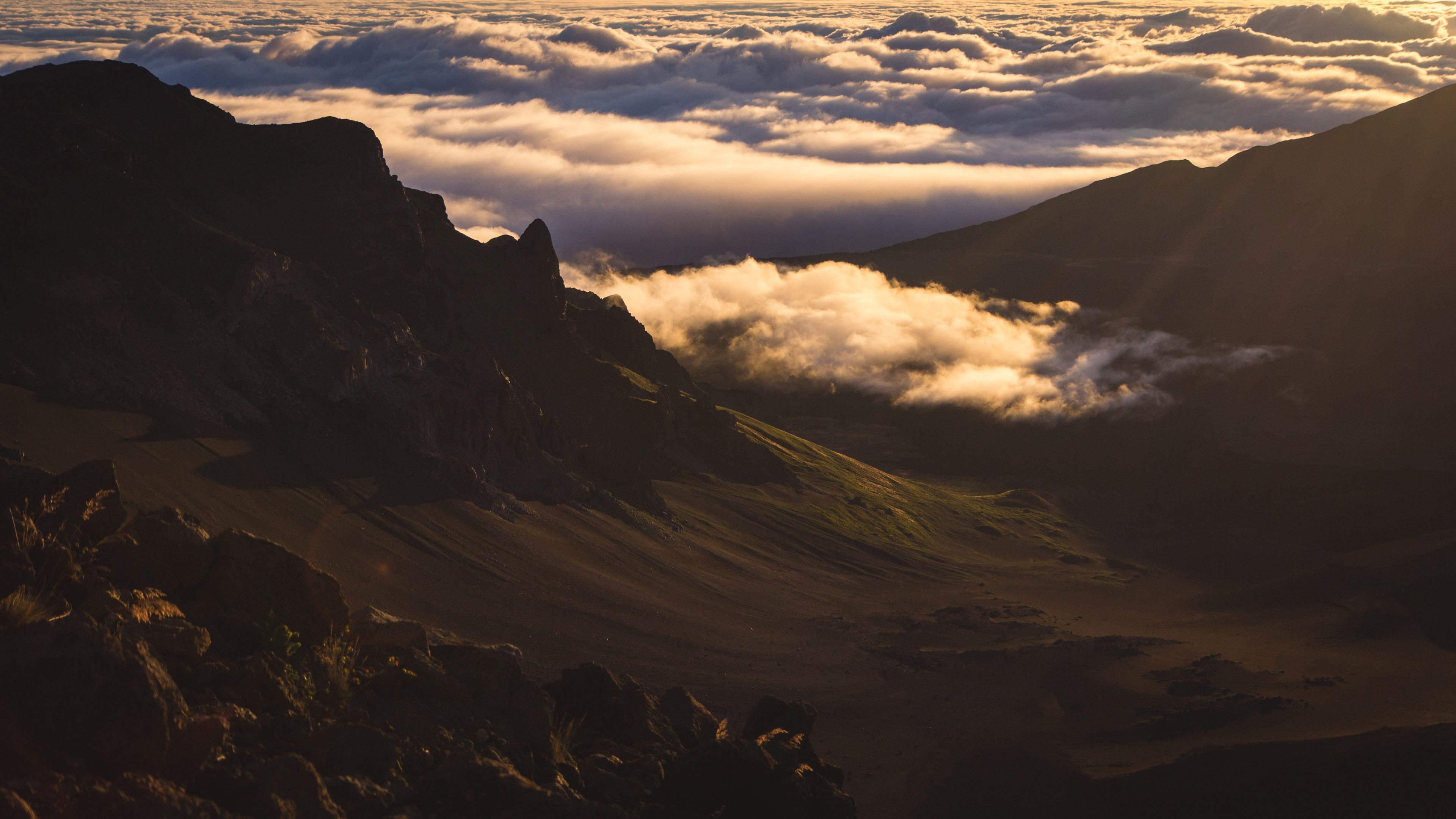 Clouds across a mountain in Haleakala National Park in Maui