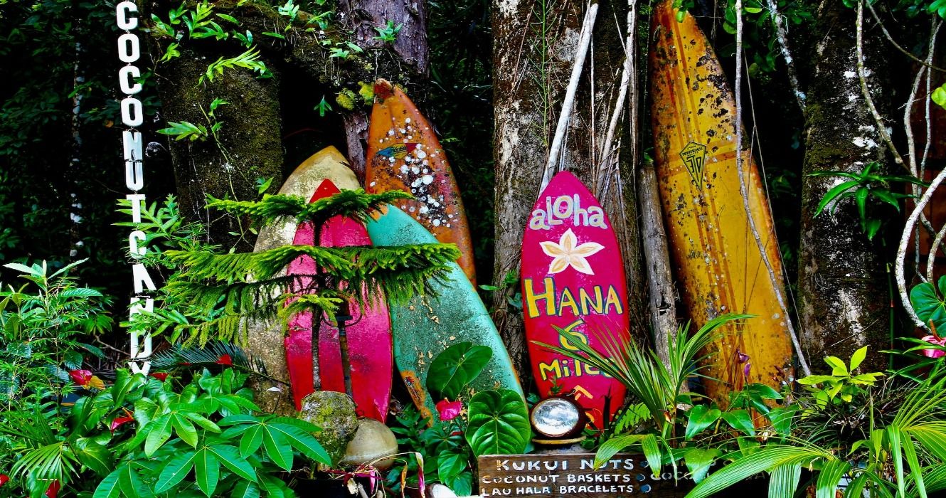 Surfboards and vendor signage along the Road to Hana Highway in Maui, 6 miles from Hana, Hawaii, USA