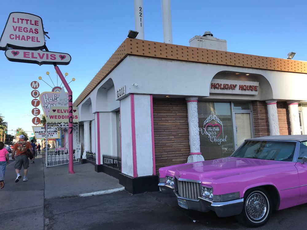 The Little Vegas Chapel in Las Vegas, Nevada, with a pink Cadillac parked at the entrance