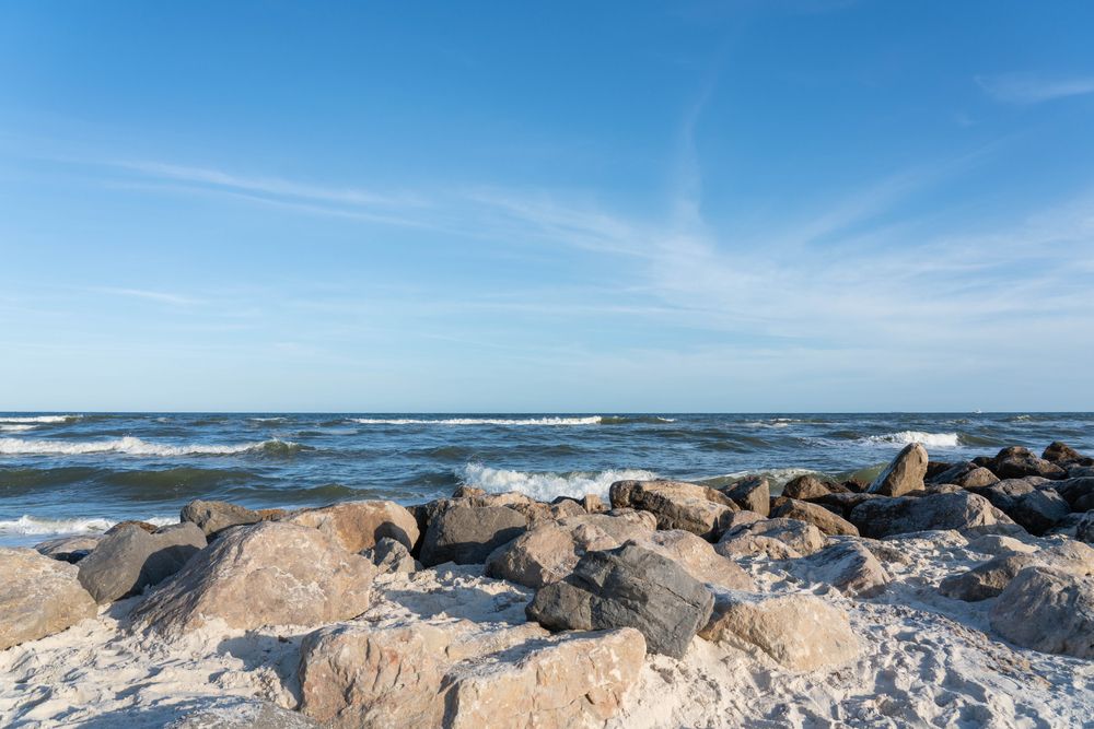 Rocks at Alabama Point East in Orange Beach, AL, with the waters of the Gulf of Mexico.