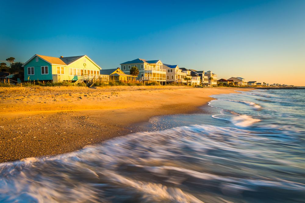 Waves in the Atlantic Ocean and the beachfront homes at Edisto Beach, South Carolina, USA