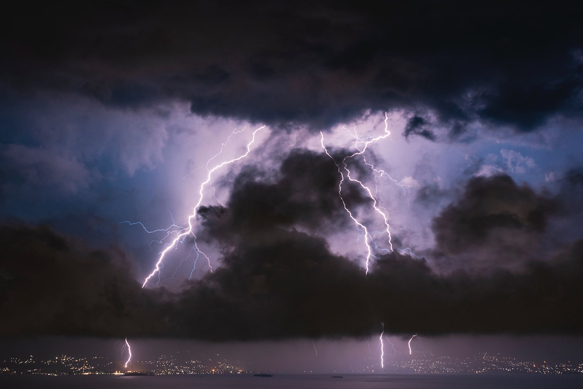 A lightning storm above the ocean at night