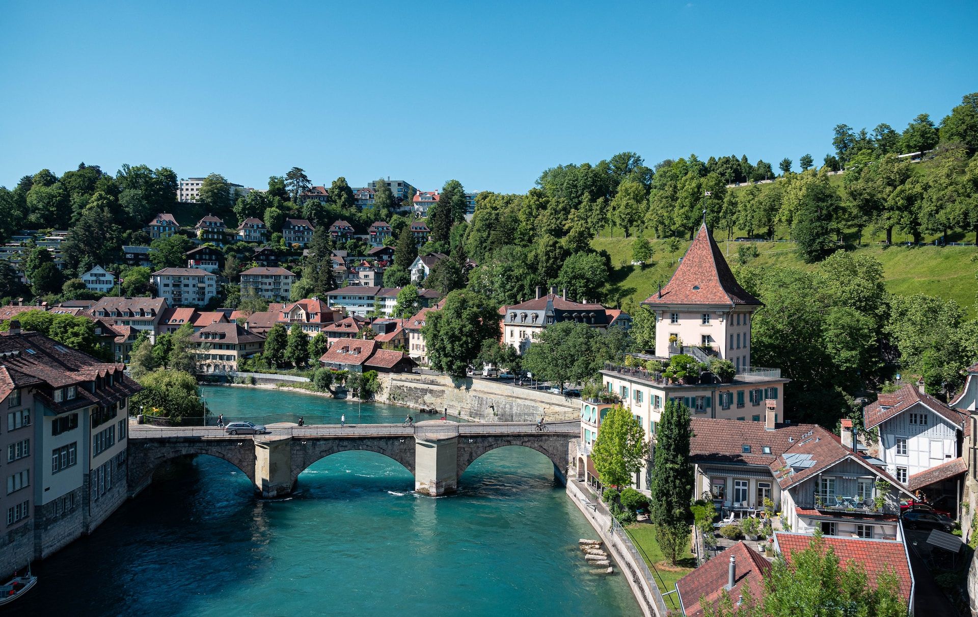 A river with houses and trees on both sides in Bern, Switzerland