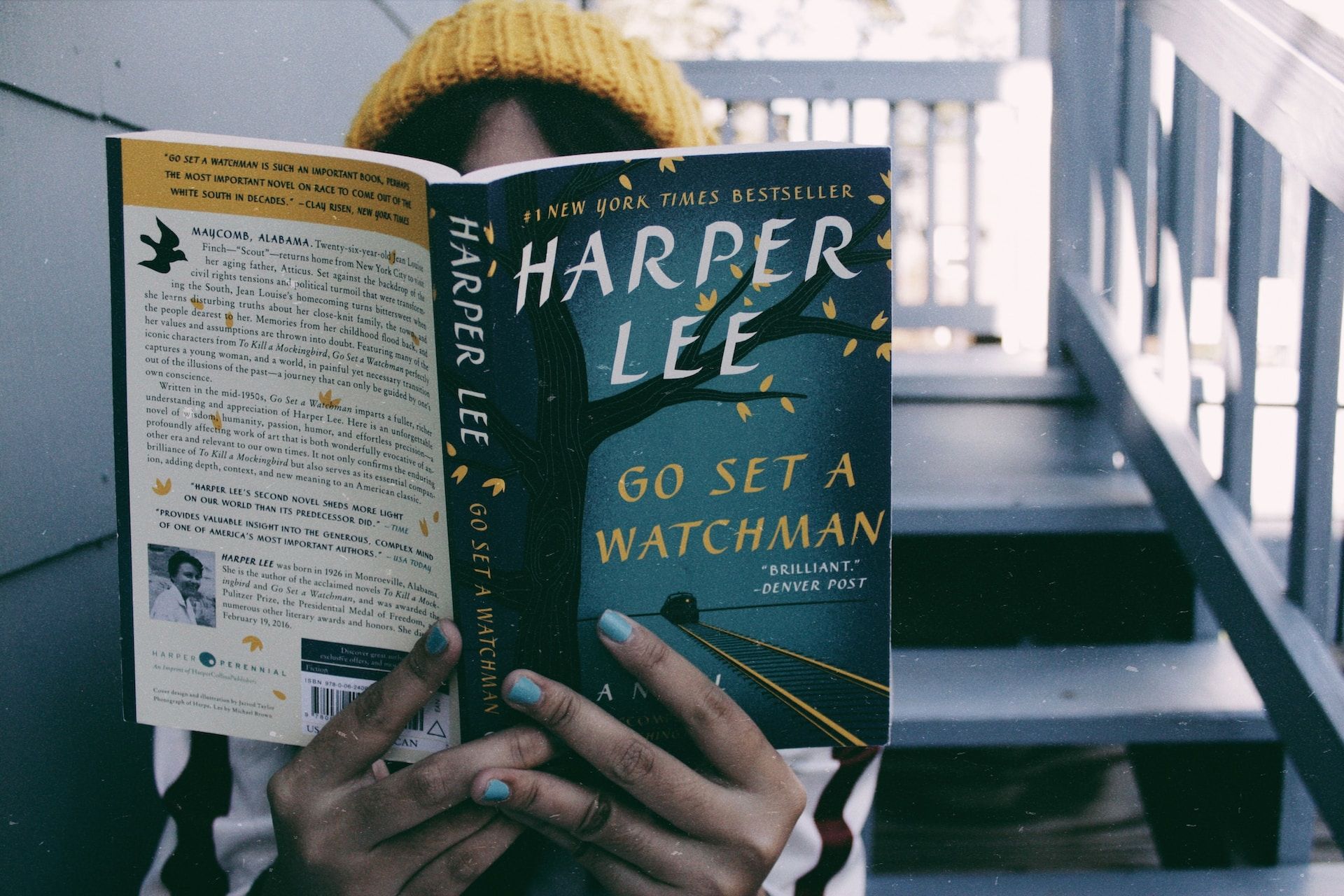 A person reading Harper Lee's ​​​​​​​