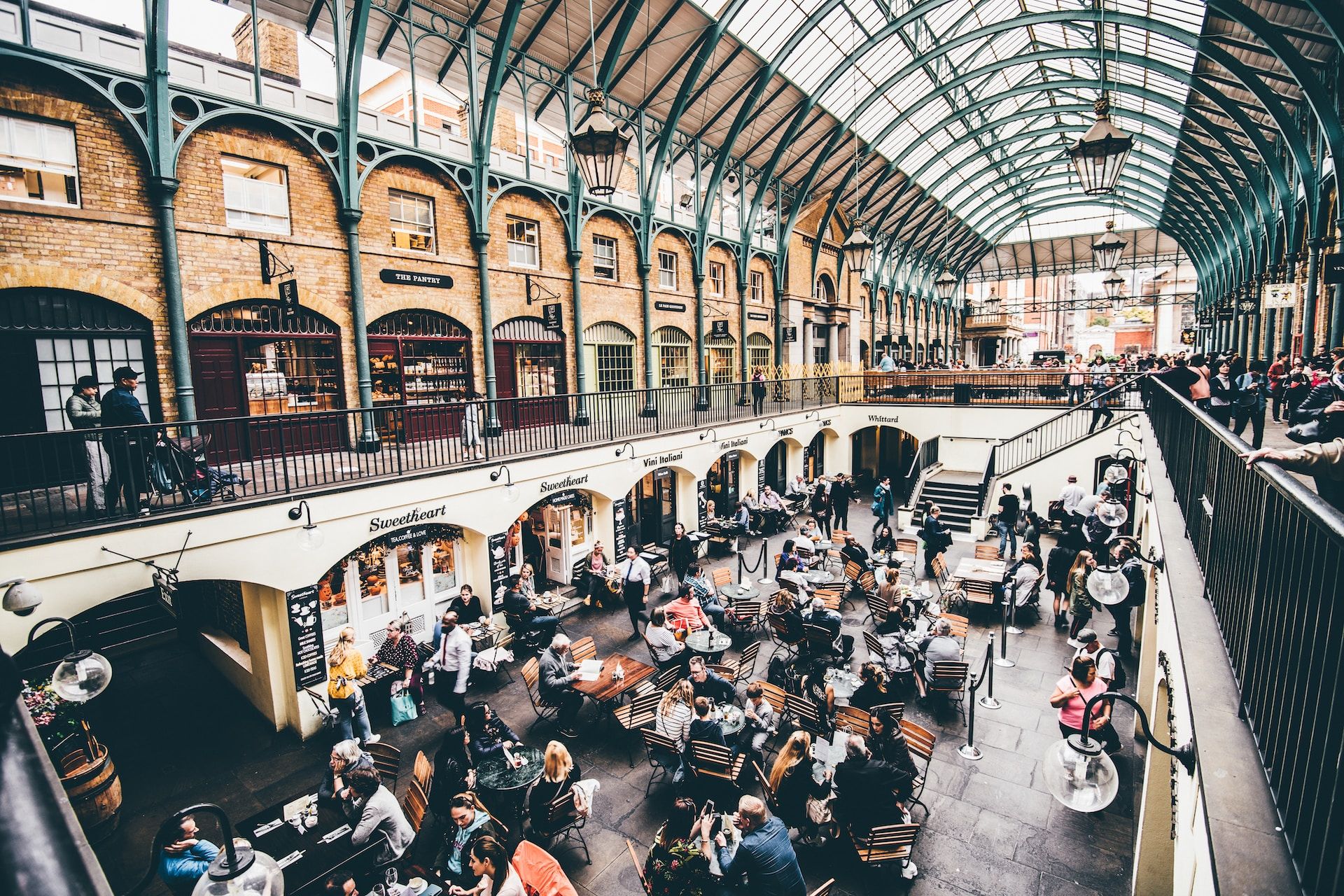  Tourists, restaurants, and shops at the Covent Garden Market, London