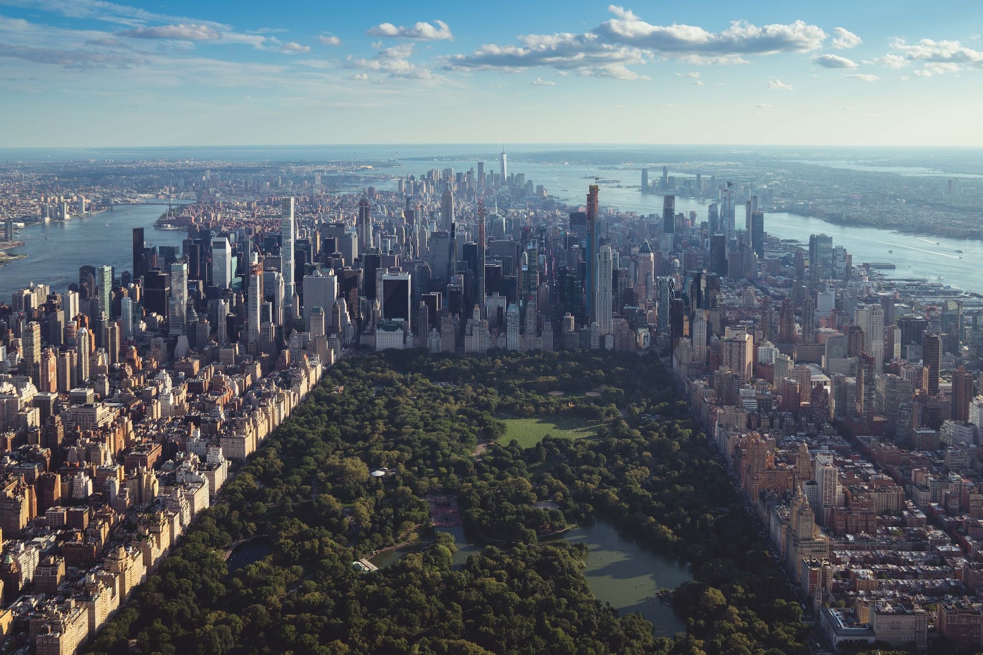 Wide and long view of Manhattan from the sky with central park, the New York City skyline, and Hudson river all in view