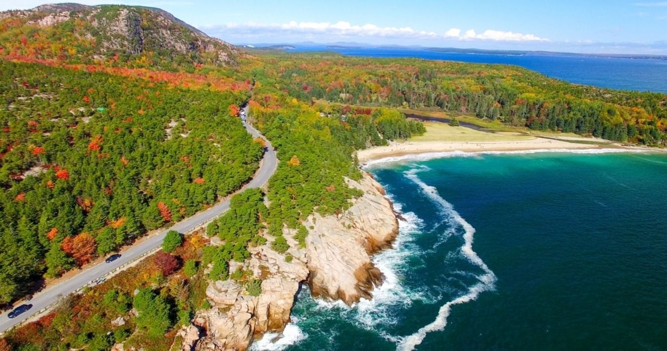 Aerial view of forests, beaches, roads, and the ocean in Acadia National Park, Maine, USA