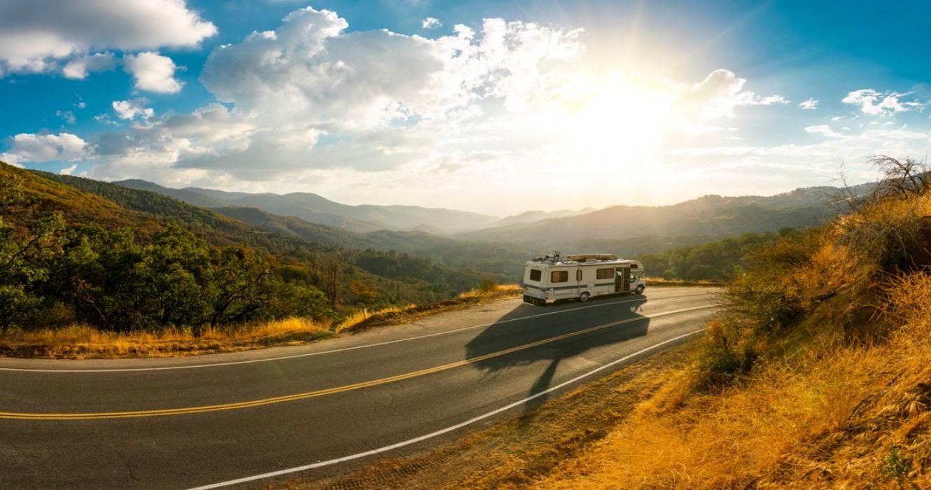 An RV motorhome traveling on a road trip in the USA