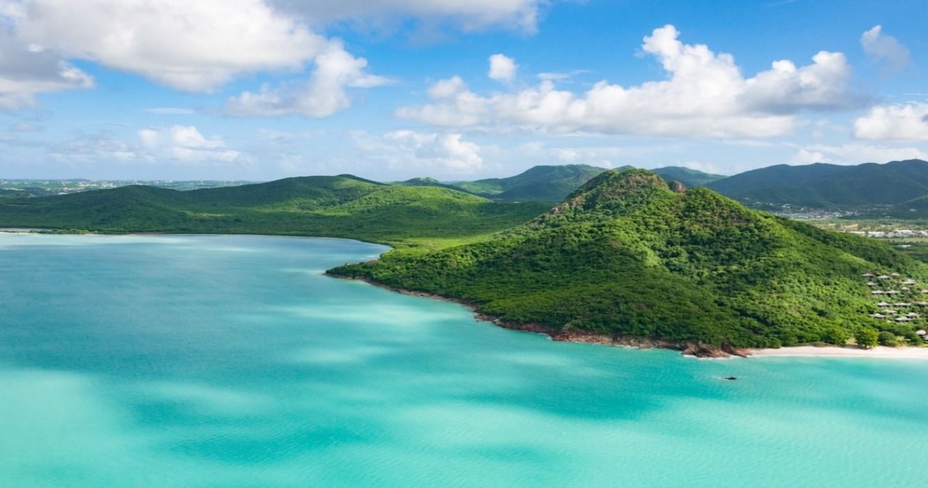 Turquoise ocean, mountains, and rainforests on the Caribbean island of Antigua