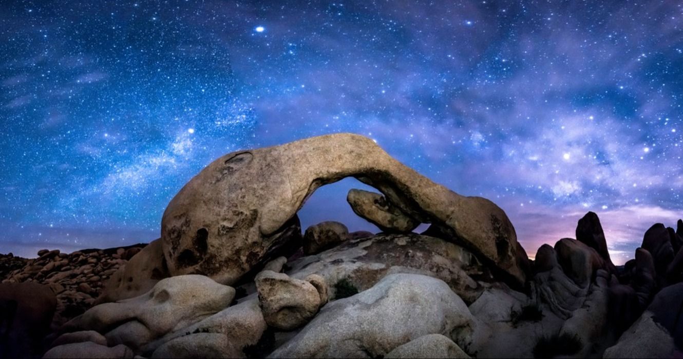 The Milky Way over Joshua Tree's Arch Rock in Joshua Tree National Park, California, USA