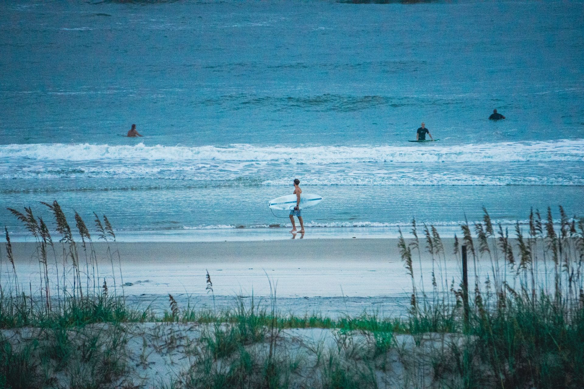 Surfers at New Smyrna Beach, Florida
