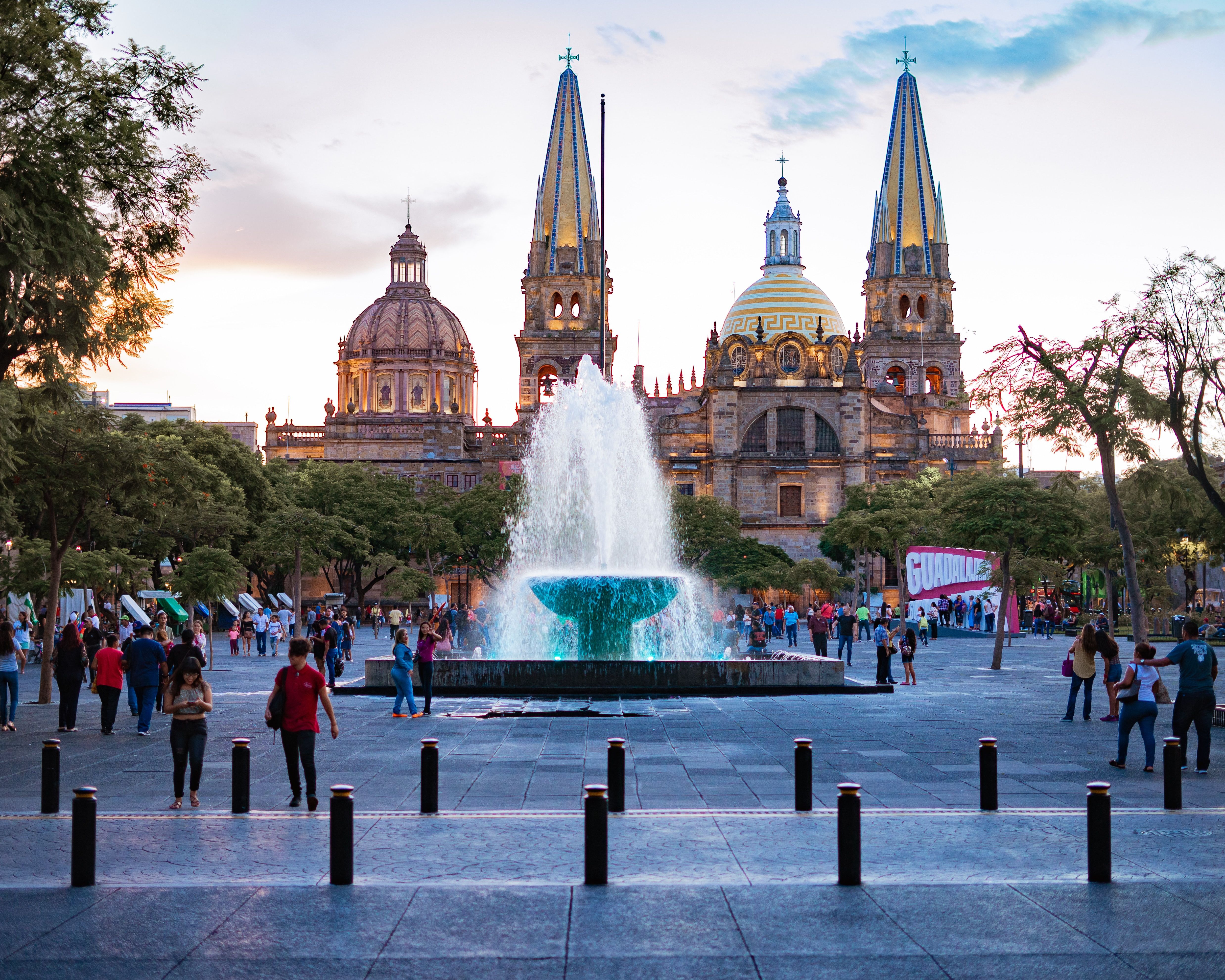 People near water fountain in Plaza de la liberacion, Guadalajara, Mexico