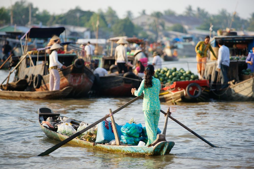 Cai Be Floating Market on the Mekong Delta River in Vietnam