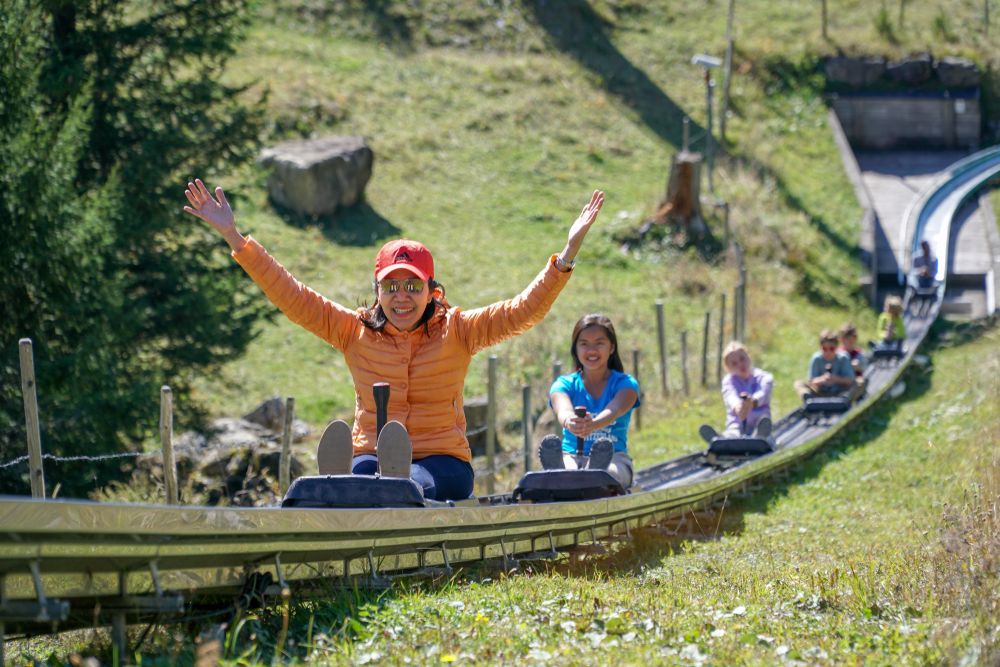 travelers enjoys riding on an alpine coaster