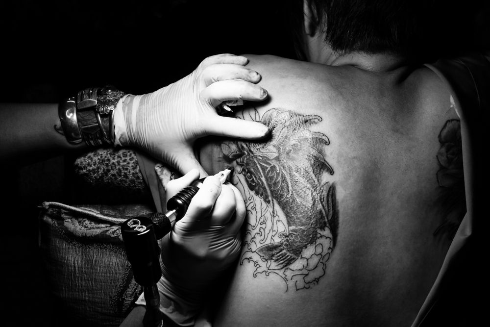 Tattooist making by professional artist