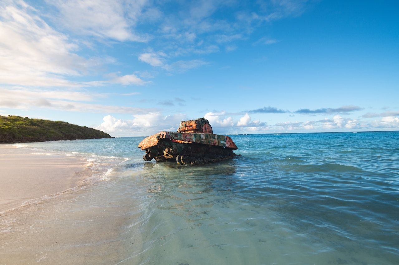 A tank being lapped in the waves on the shore of Culebra