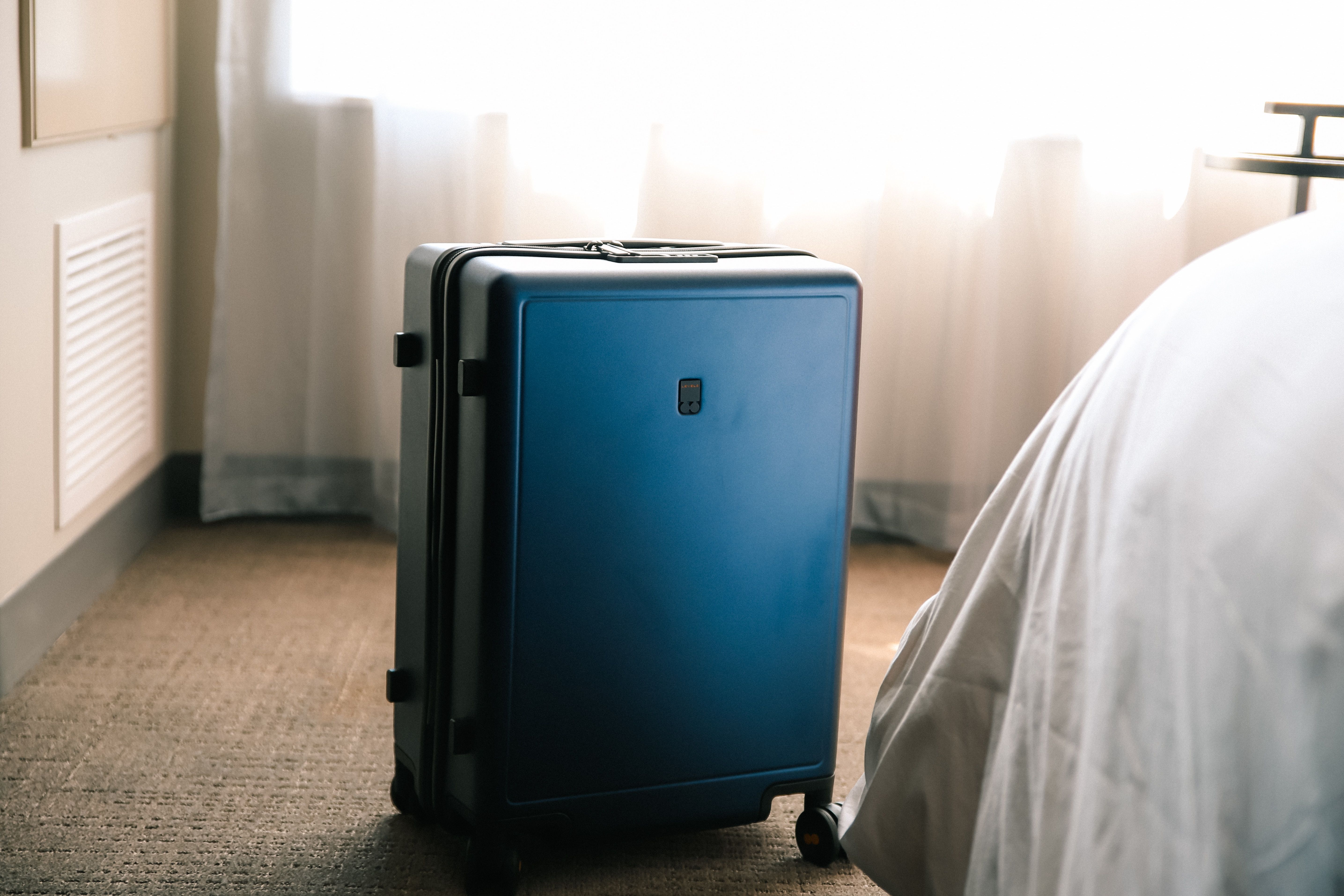 Suitcase in a hotel room