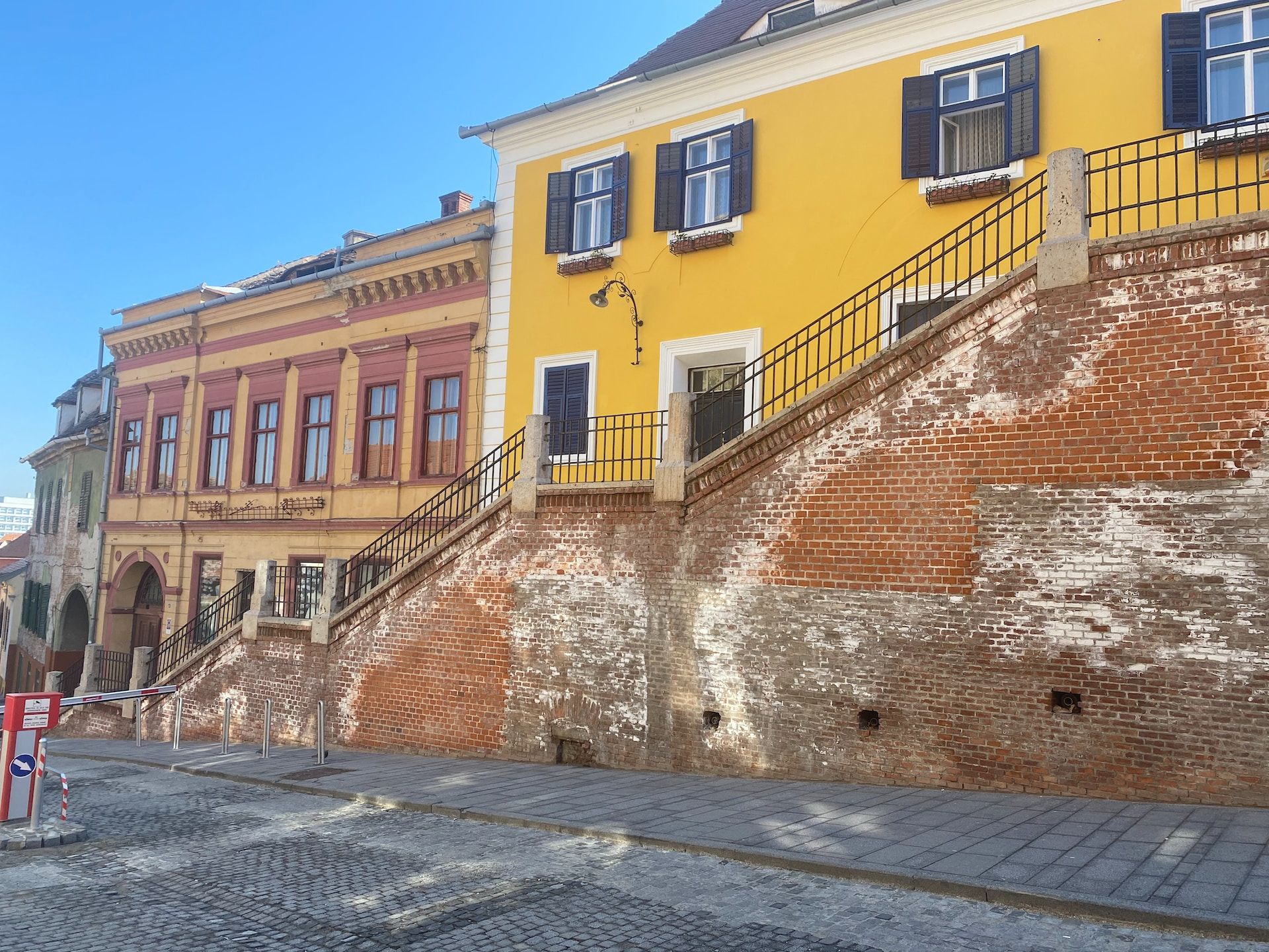 Yellow building alongside a street in Sibiu, Romania 