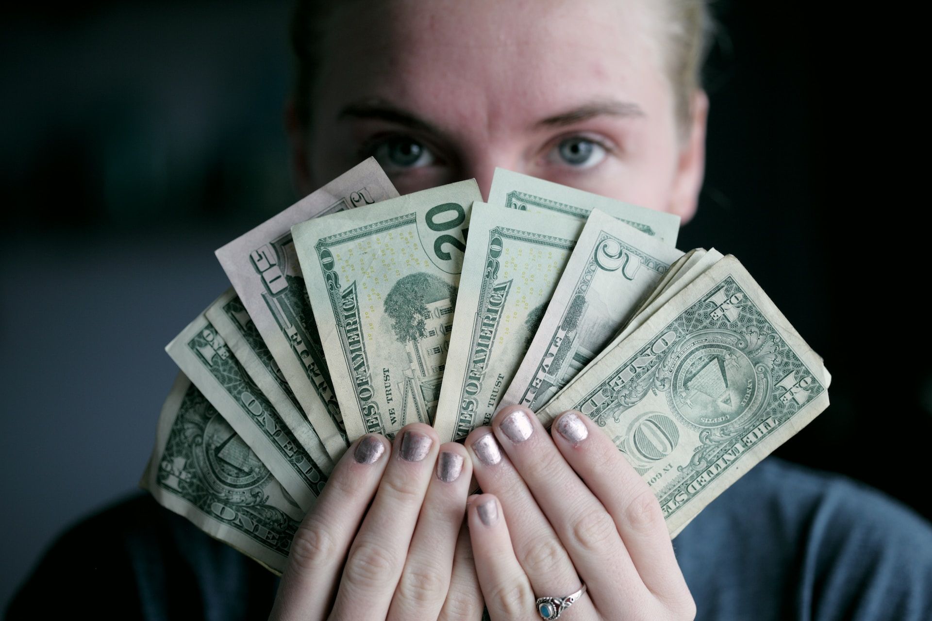 A Person Holding Money In Ogden, USA