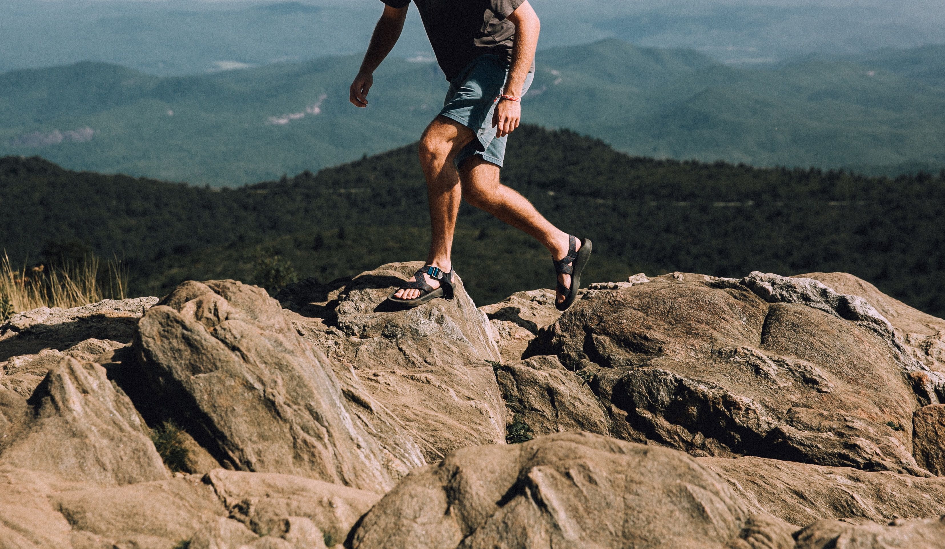 A person walking on rocks in Black Balsam Knob, United States