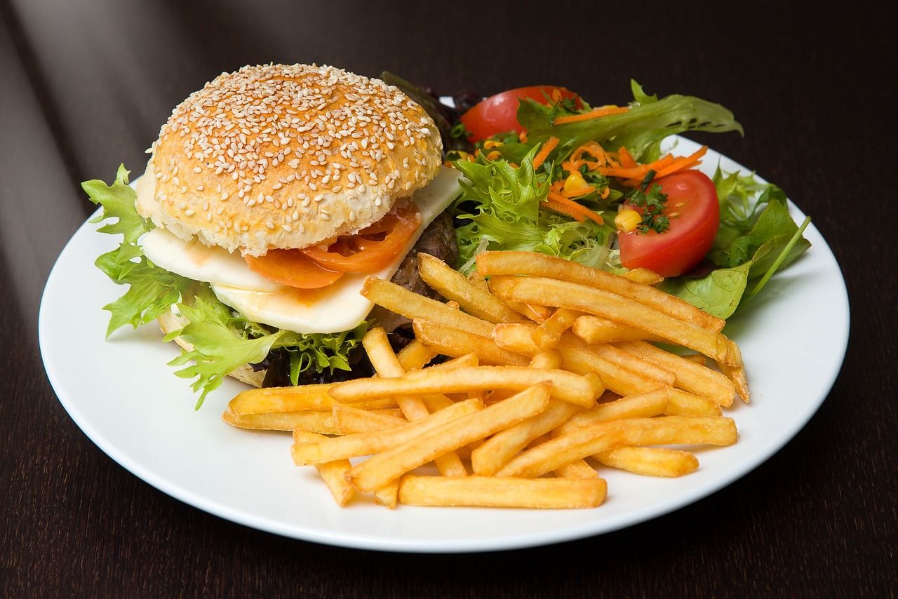 Burger with fries and salad