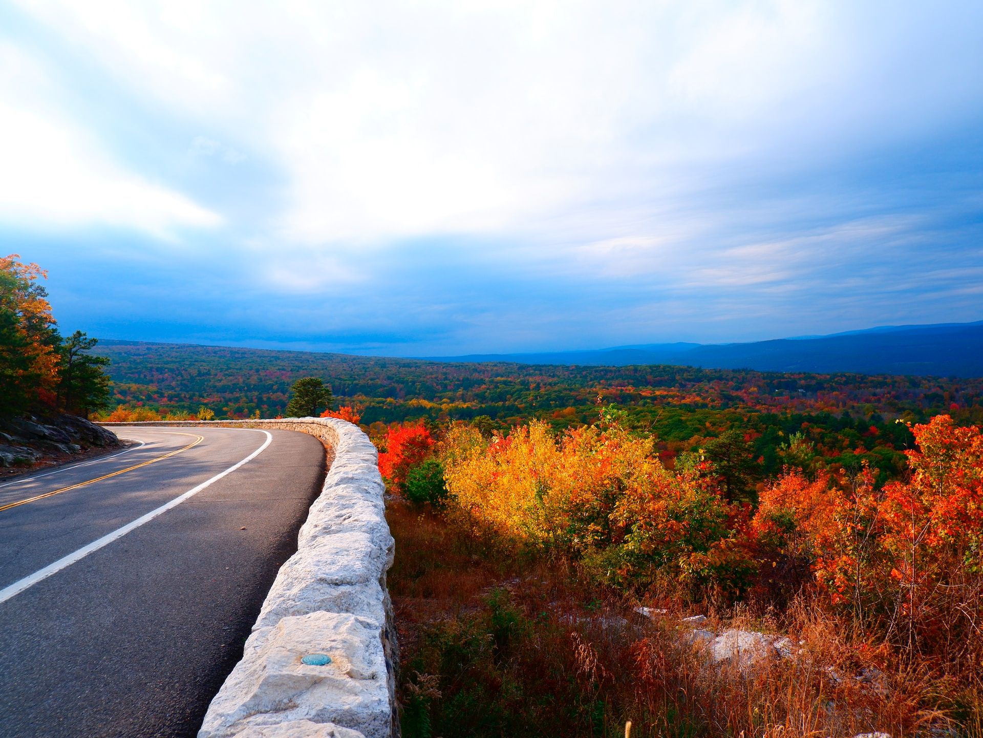 Highway winding through colorful autumn foliage in Catskill, New York