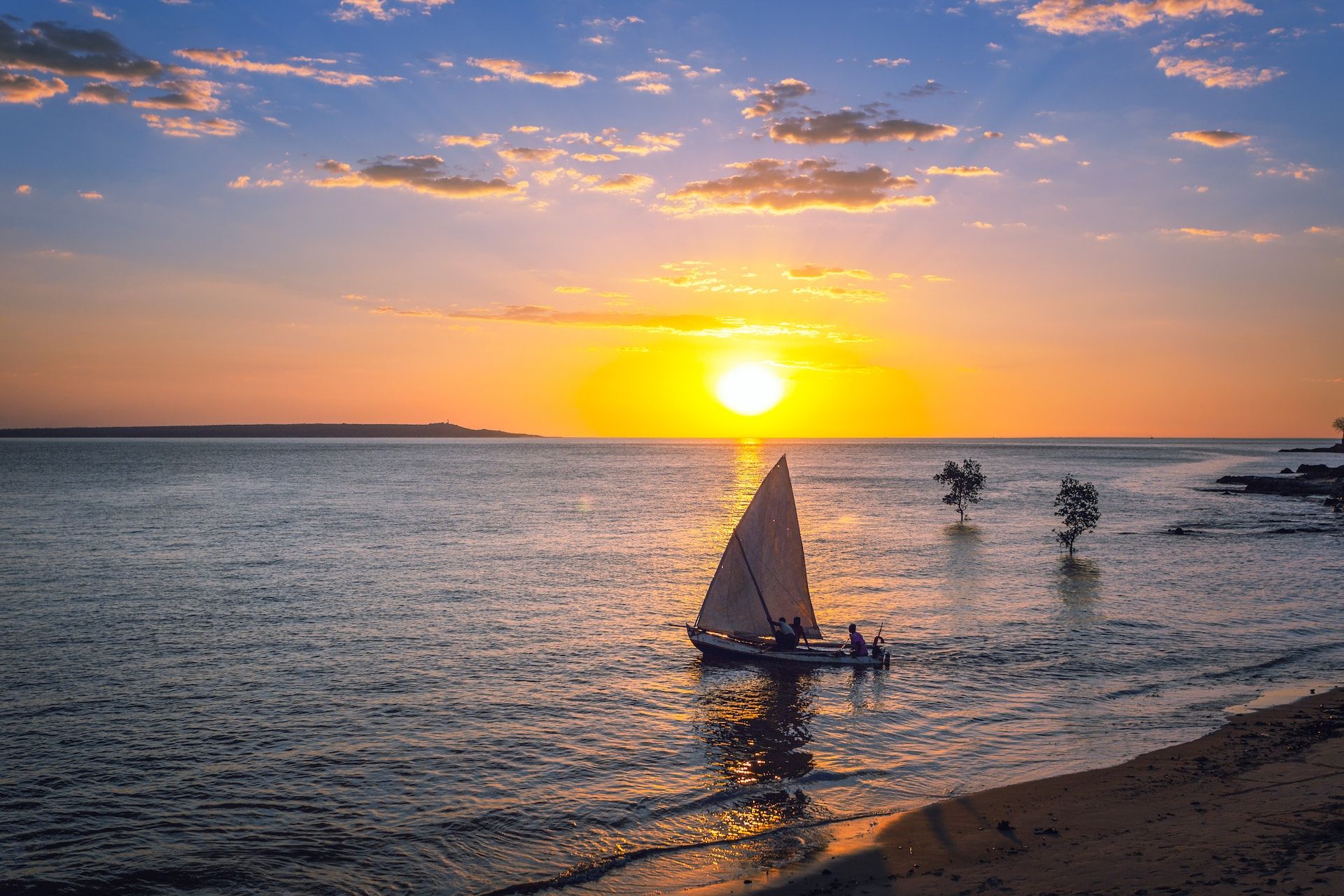 A yatch on the water at sunset in Madagascar