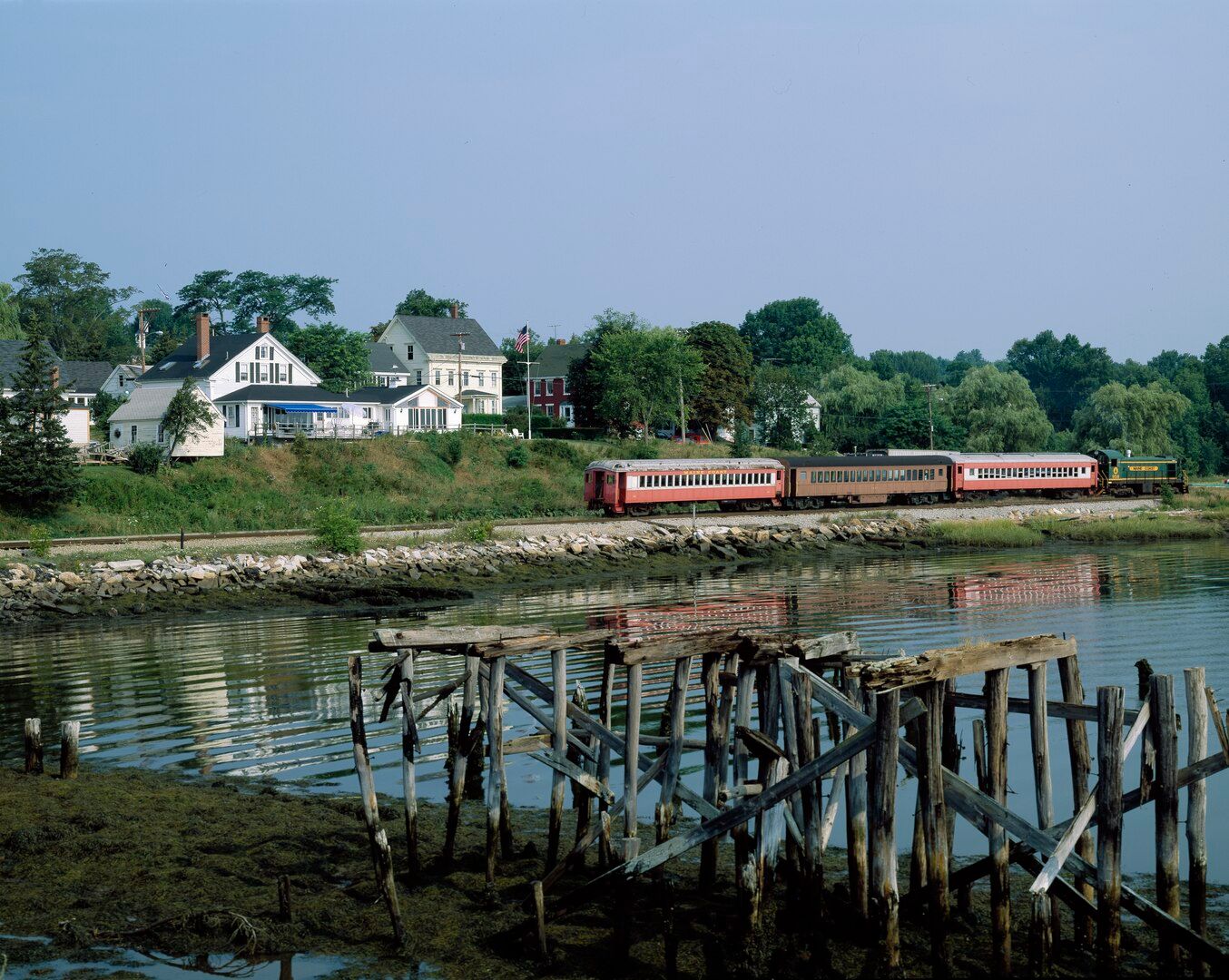 Train and homes along the water in Wiscasset, Maine, USA