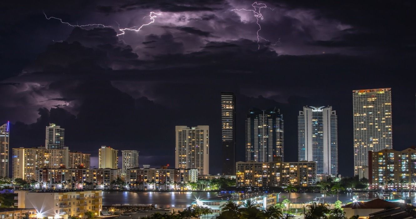 A thunderstorm and lightning strike above the city of Miami, Florida, USA