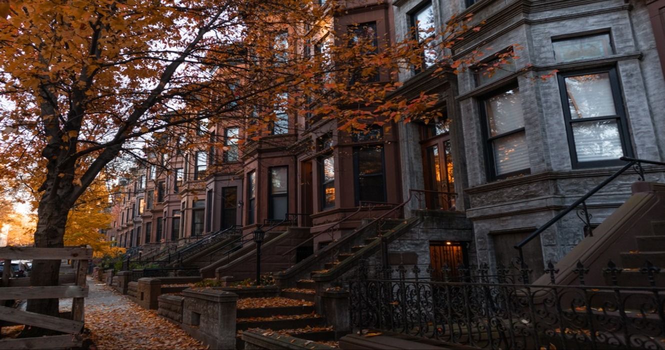 Old Brownstone Homes with fall foliage in Park Slope, Brooklyn, New York, USA
