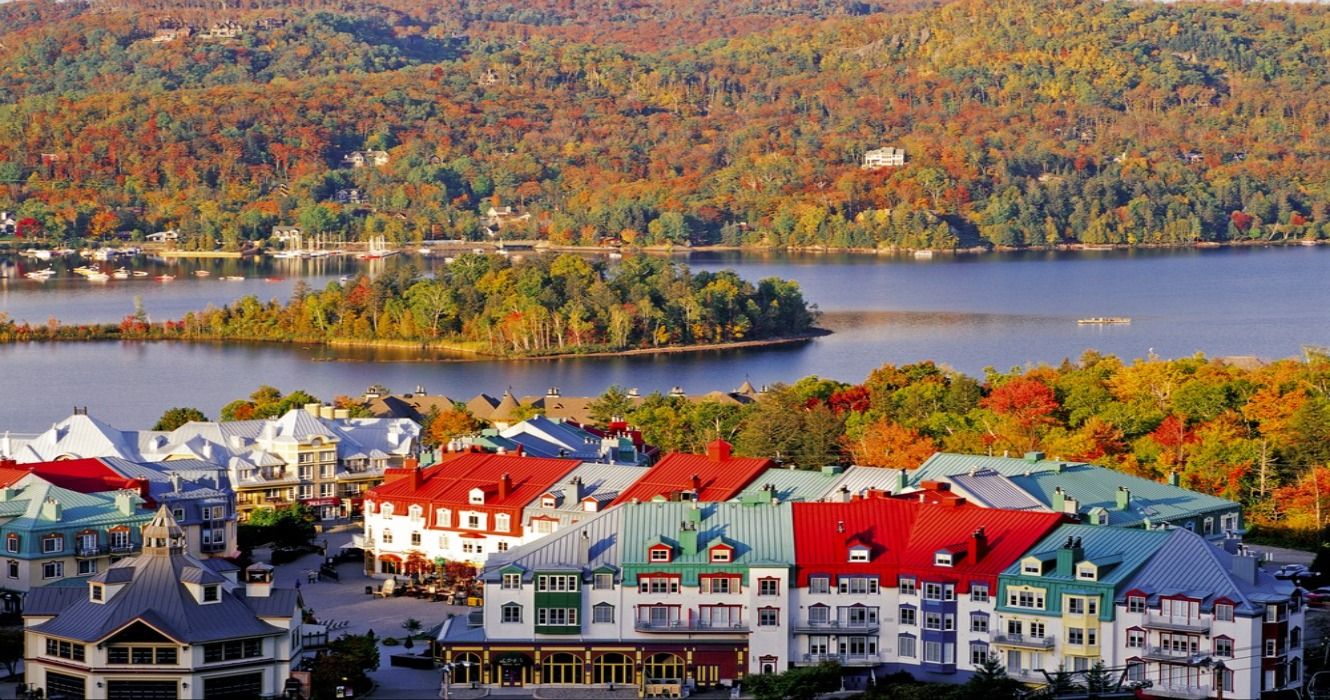 Scenic view over Mont-Tremblant Resort and colorful foliage of the surrounding forest, Quebec, Canada