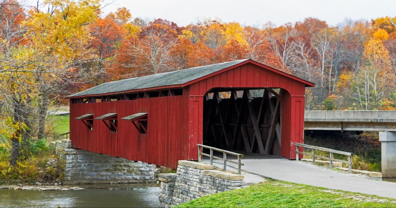 Cataract Covered Bridge in Indiana surrounded by fall foliage in the autumn, USA
