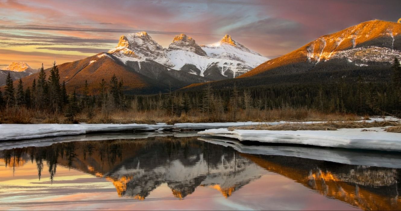 An early morning sunrise at Three Sisters near Canmore, Alberta, Canada