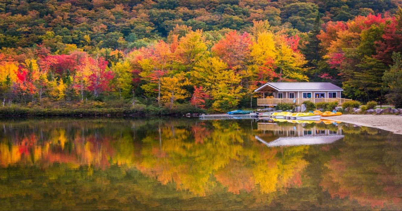 Boathouse and fall foliage colors at Echo Lake, Franconia Notch State Park, New Hampshire, USA