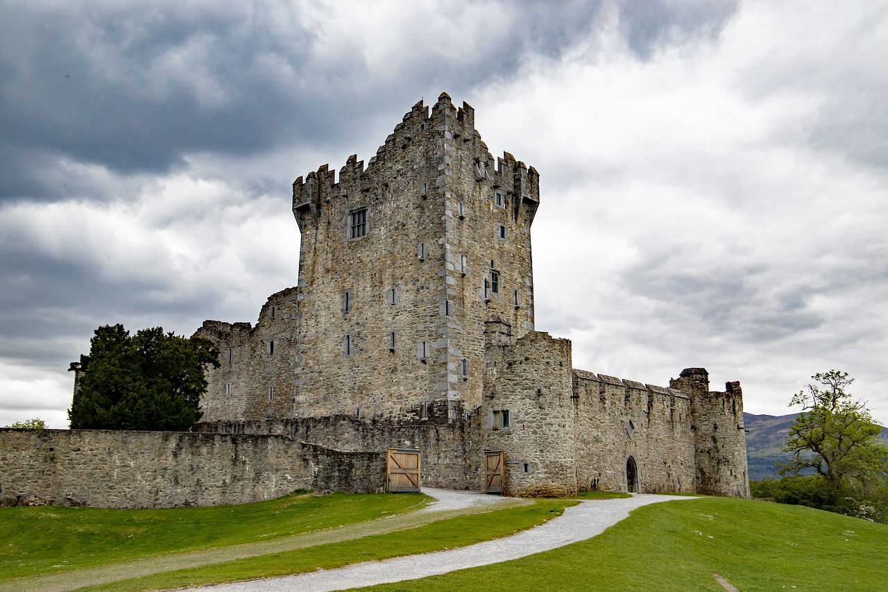 A cloudy grey sky over Ross Castle in Ireland