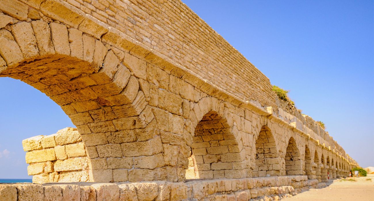 Ruins of ancient aquaeduct in Cesarea in Israel