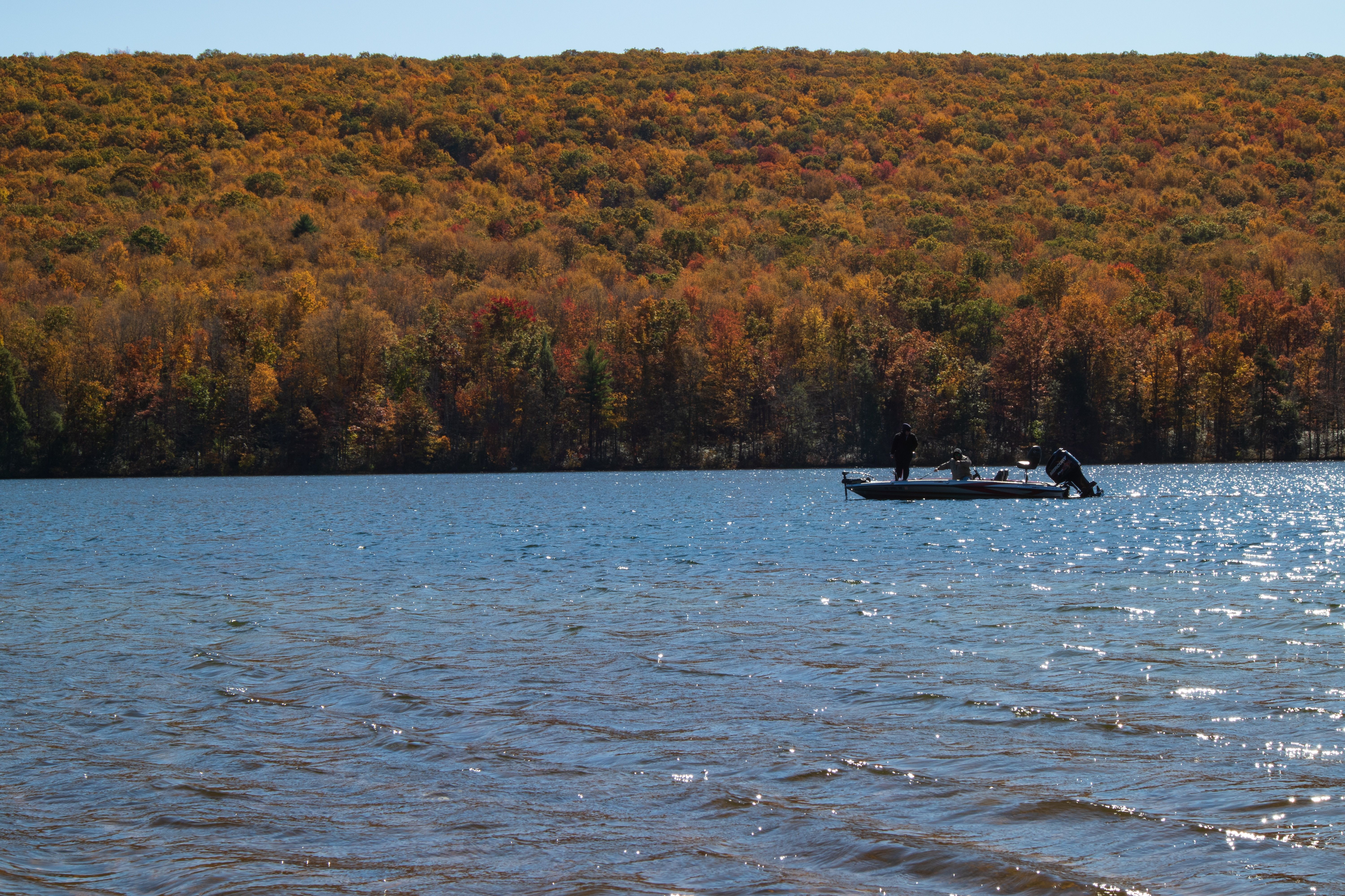 Boat on a body of water at Mauch Chunk Lake Park in Jim Thorpe during fall
