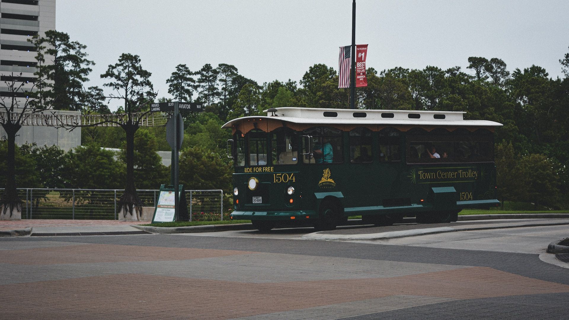 A Bus Driving Down The Streets In The Woodlands, TX, USA