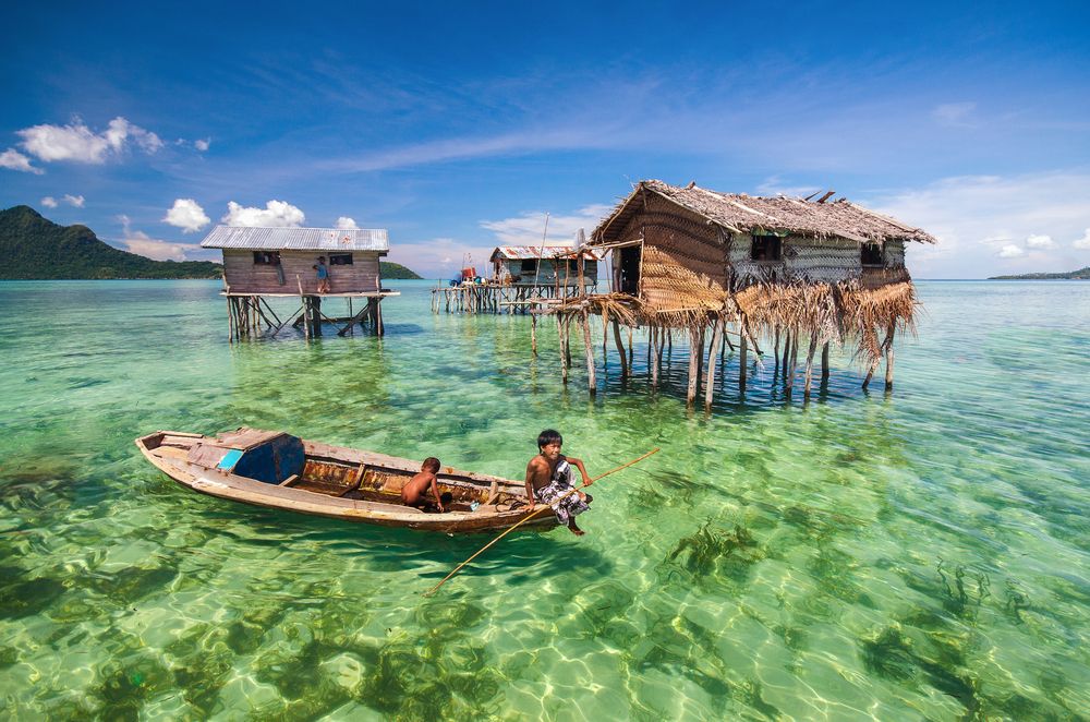Bajau Laut people on a wooden boat on Maiga Island, Semporna Sabah, Malaysia