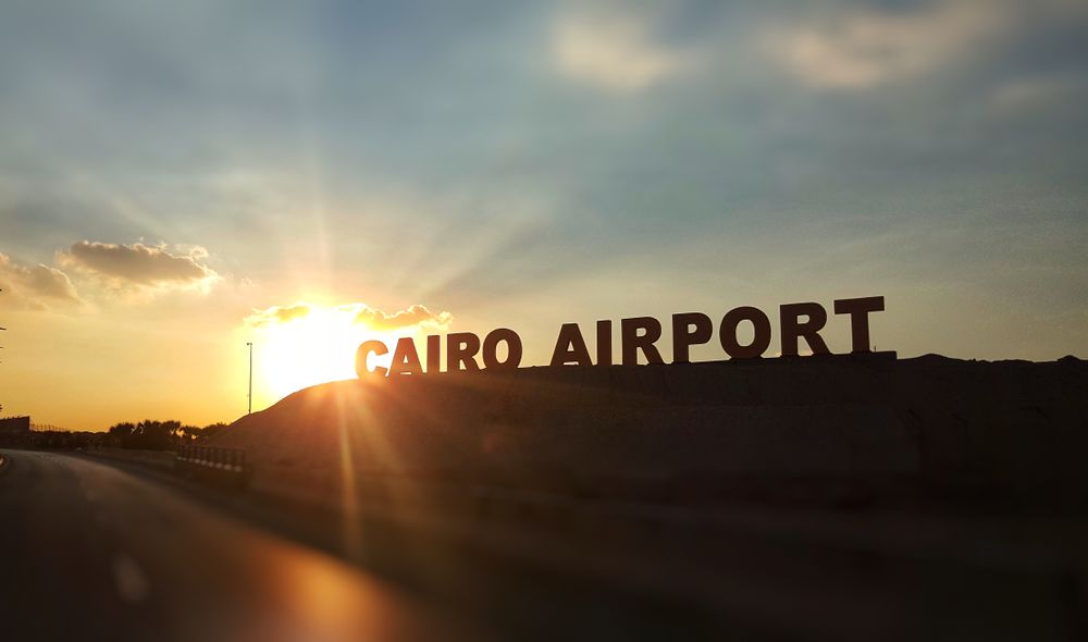 Sunset at the background with Cairo Airport Signboard