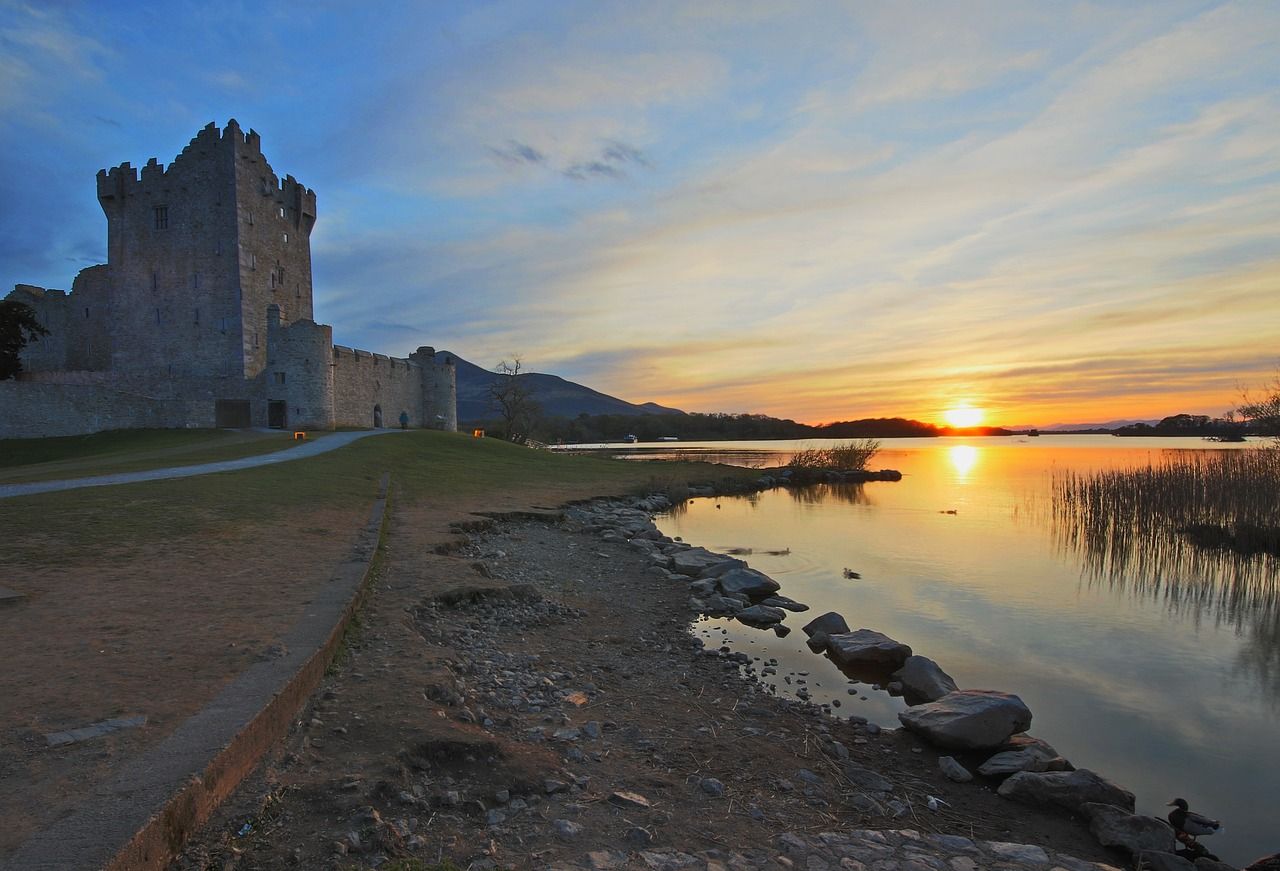 The sun sets over the Ross Castle in Killarney