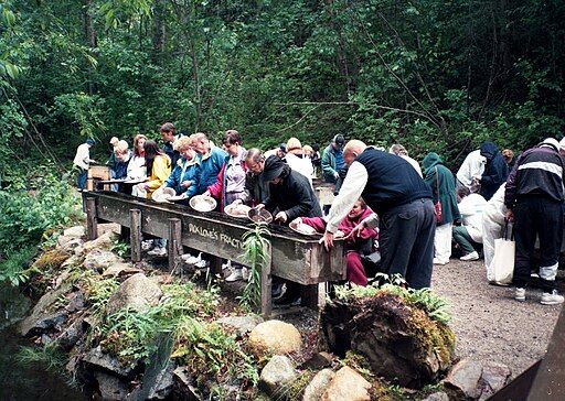 Tourists trying gold panning in Skagway