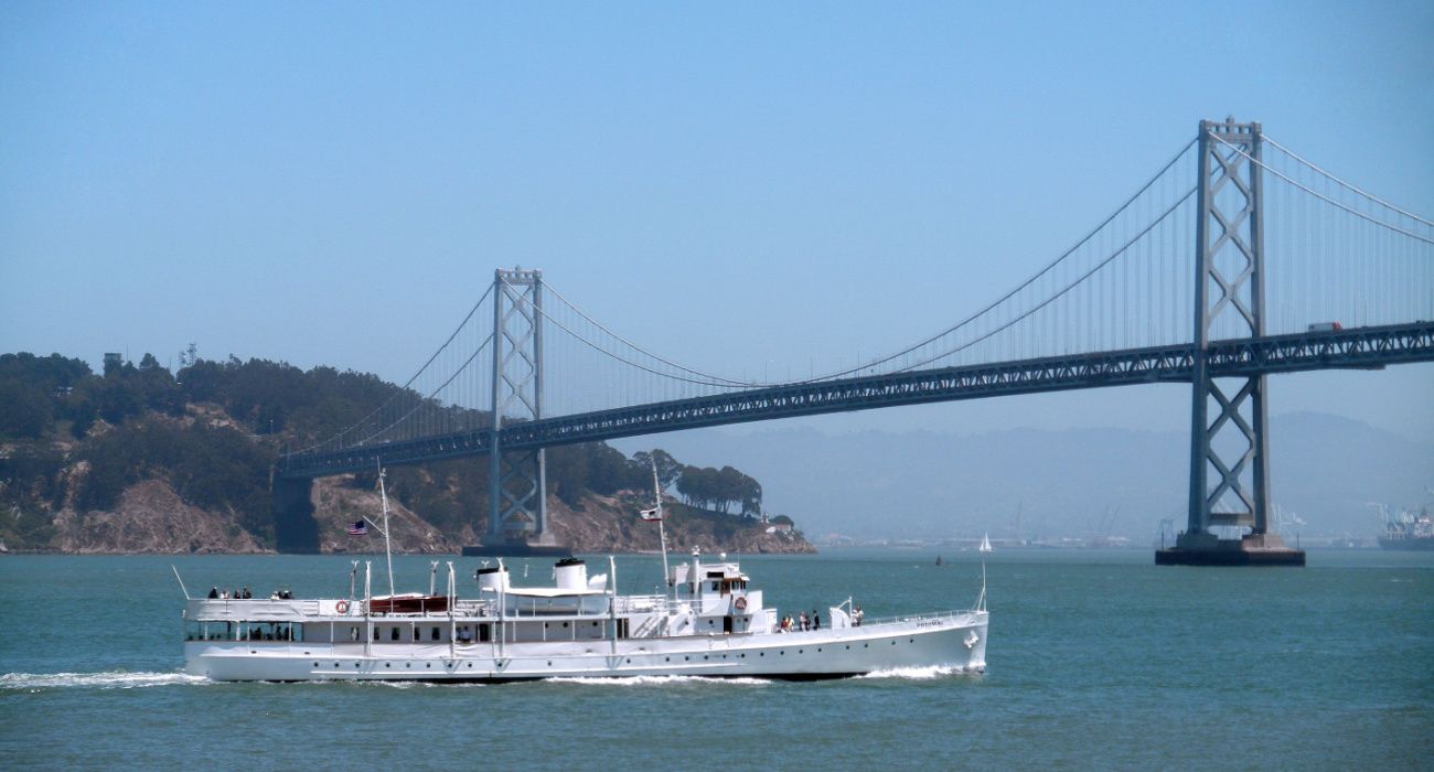 USS Potomac sails towards the Bay Bridge