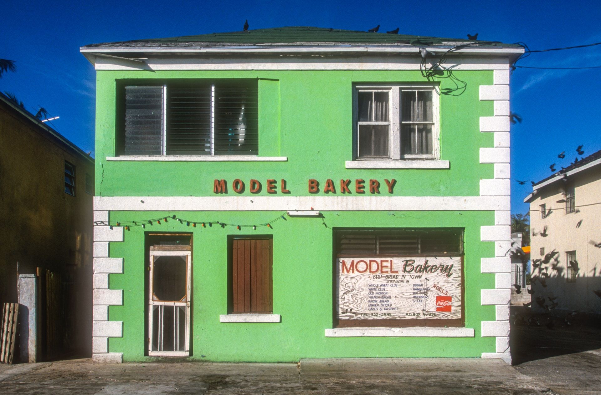 Bright green bakery storefront in Nassau, Bahamas