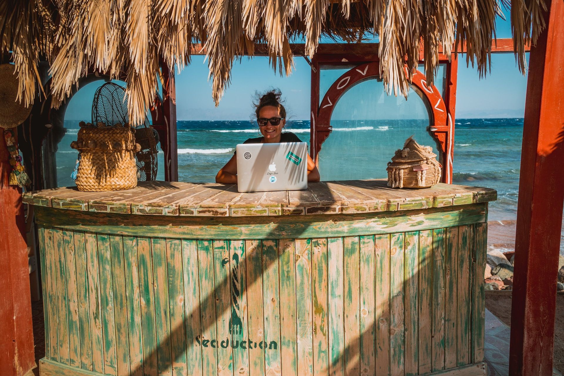 A digital nomad on a laptop in Dahab, Egypt