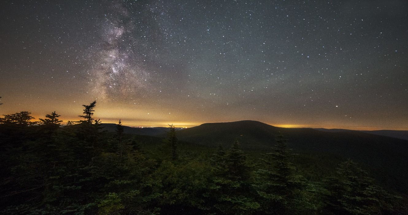 A Milky Way night sky above a forest in the Catskill Mountains, The Catskills, New York, USA
