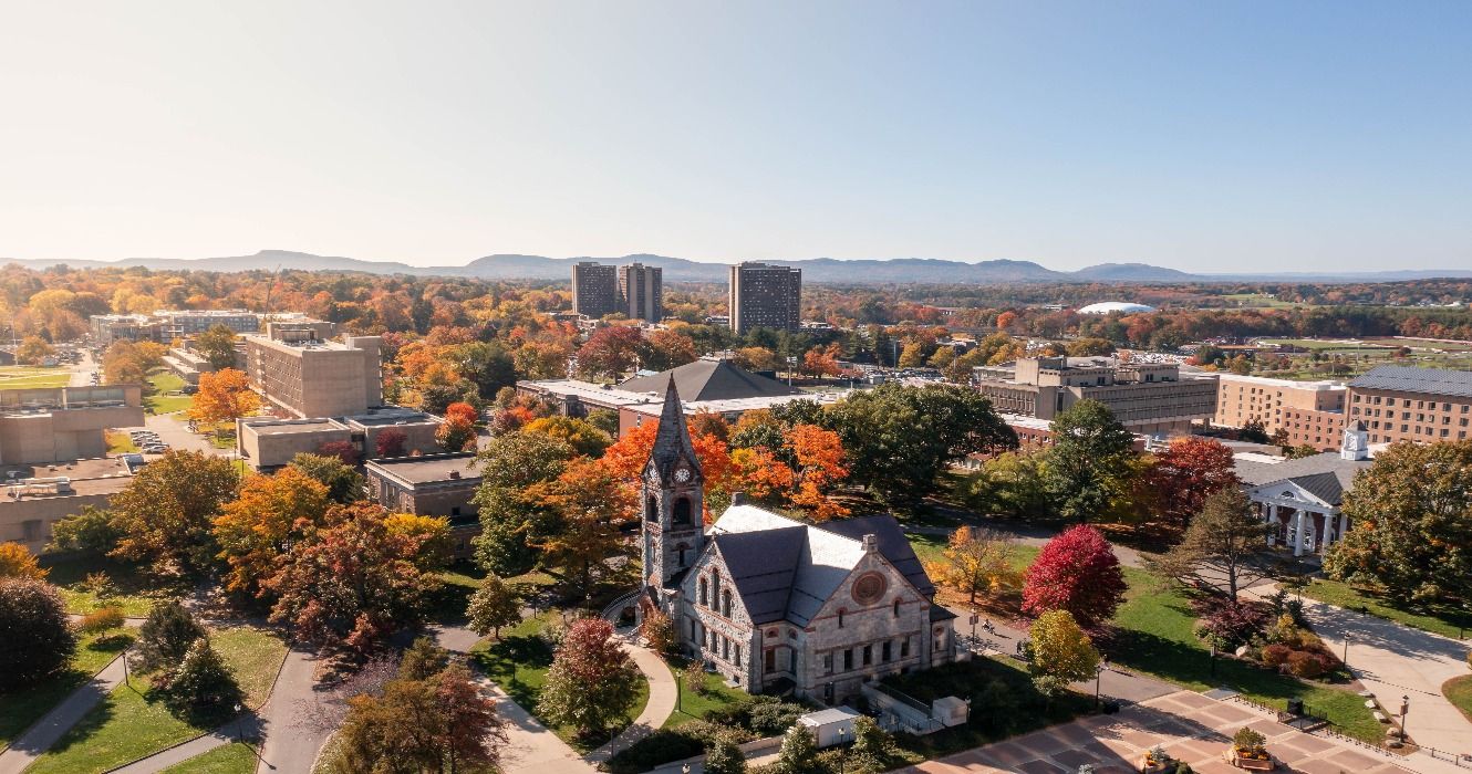 An aerial view of fall foliage in the autumn around the University of Massachusetts Amherst campus in Amherst, MA, USA