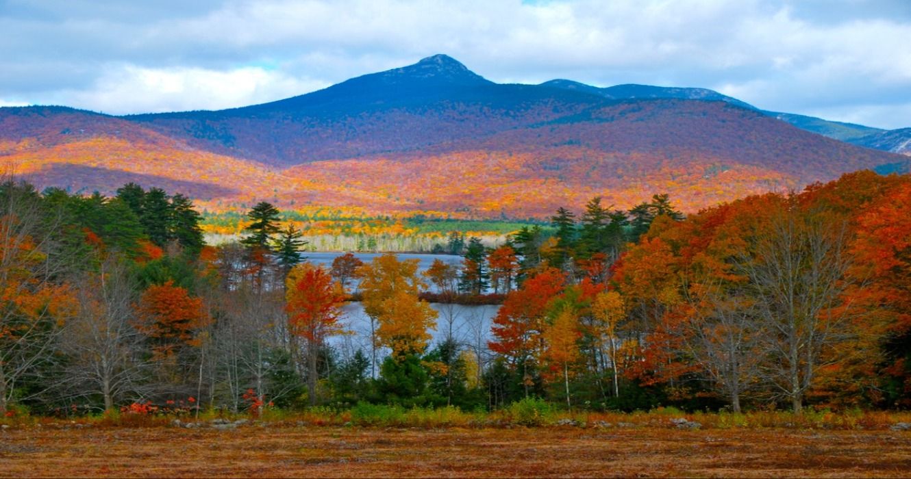 Autumn colors and fall foliage at Mount Chocorua behind Chocorua Lake in New Hampshire, New England, USA