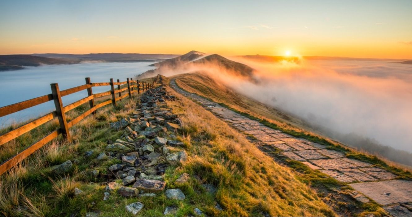 Sunrise across the landscape seen from Mam Tor in the English Peak District, England, United Kingdom